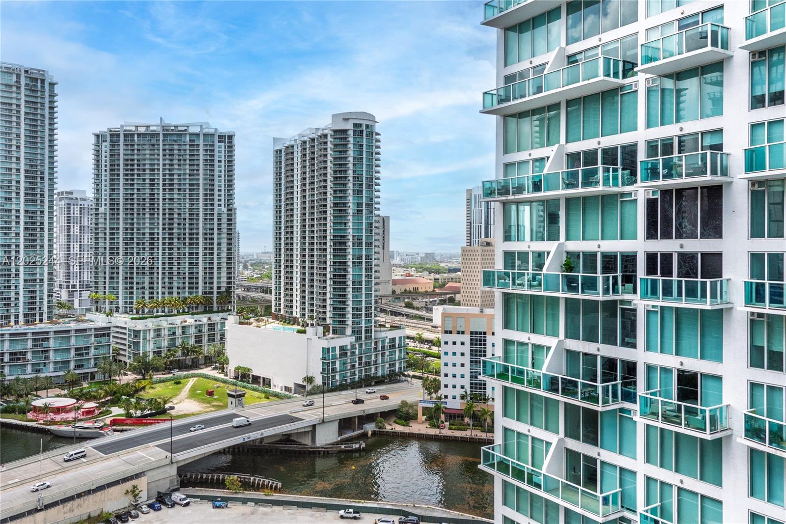 An elevated view of a city skyline featuring modern high-rise buildings and a bridge — 31 SE 6th St # 2506, Miami FL 33131, MIAMI, FL