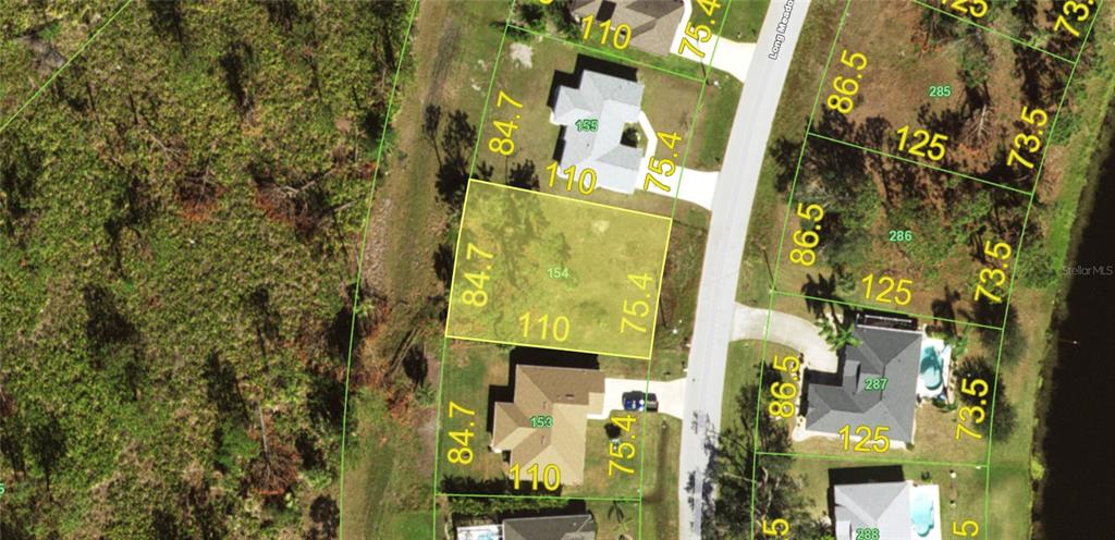 This is an aerial map showing a vacant residential lot highlighted in yellow — 135 LONG MEADOW LANE, ROTONDA WEST, FL