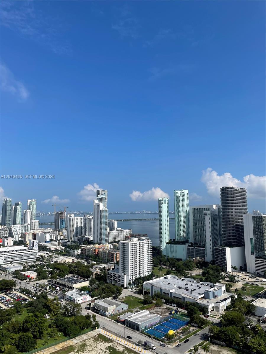 An elevated view of a city skyline with numerous high-rise buildings overlooking a bay — 1600 NE 1st Ave # 3603, Miami FL 33132, MIAMI, FL