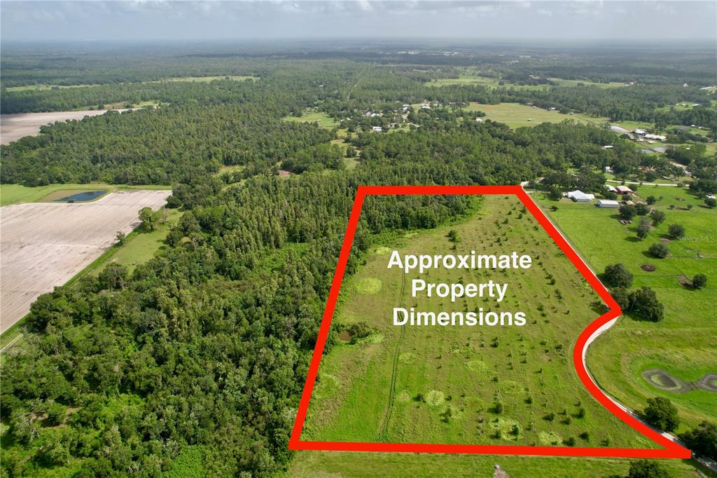 An aerial view shows a plot of land outlined in red within a rural landscape — 0 HANCOCK ROAD, LAKELAND, FL