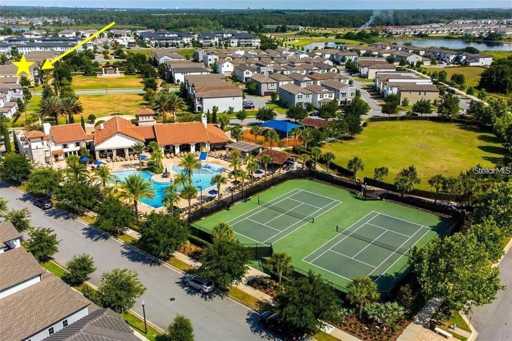 An aerial view of a residential community featuring a swimming pool and two tennis courts — 14654 WATOWAN ALLEY, WINTER GARDEN, FL
