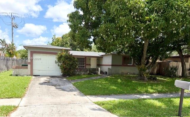 A one-story house with a garage and a large fruit-bearing tree in the front yard — 8001 NW 3rd Pl, Margate FL 33063, MARGATE, FL