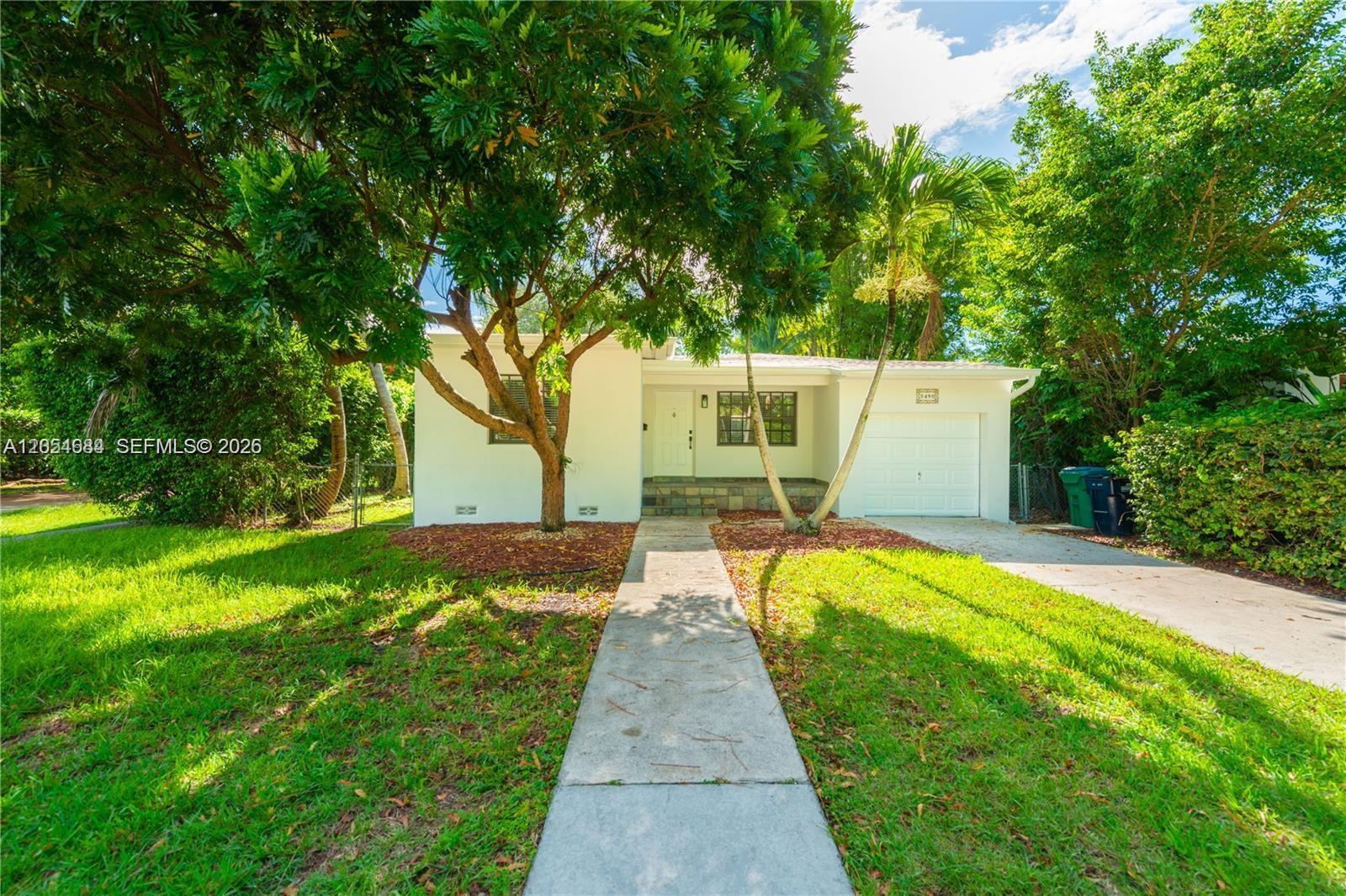 A single-story house with a white exterior, a front walkway, and a one-car garage — 5490 SW 57 Ave # 0, Miami FL 33155, MIAMI, FL