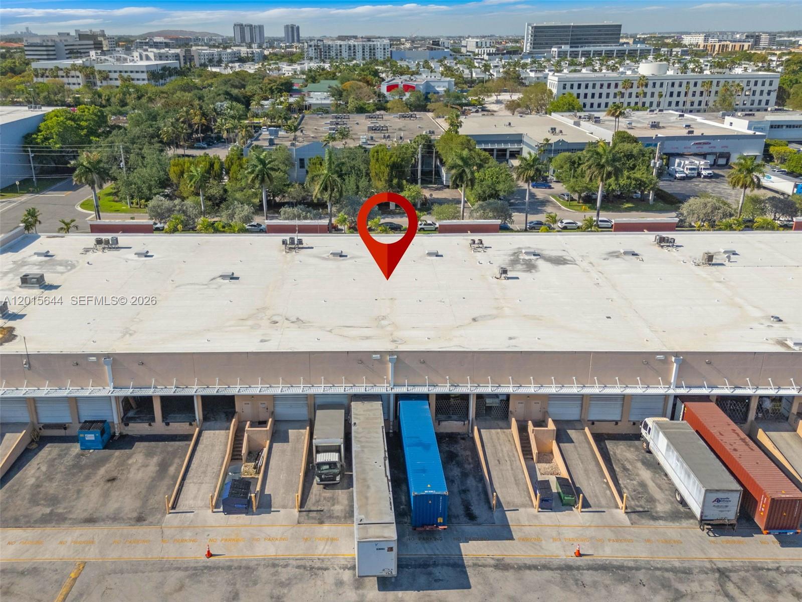 An aerial view shows the flat roof and loading dock area of a commercial warehouse building — 8344 NW 30th Ter, Doral FL 33122, DORAL, FL