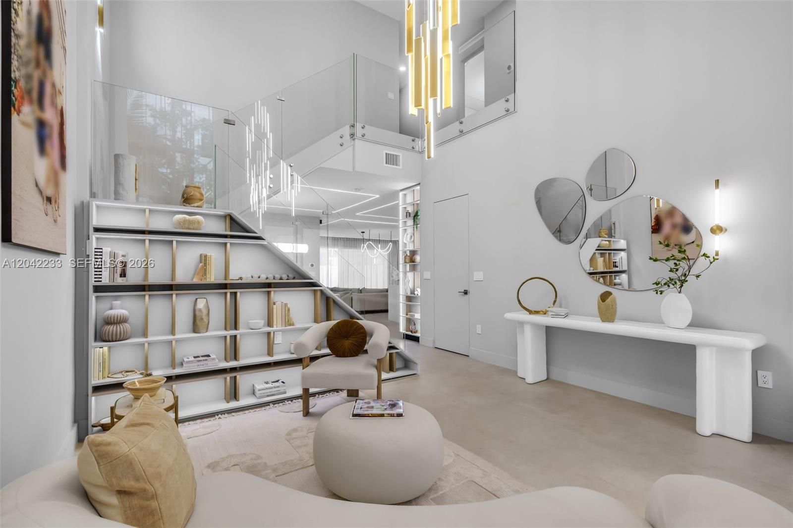 A modern living room features a built-in staircase bookshelf, glass railings, and a white console — 7533 NW 98th Ct, Doral FL 33178, DORAL, FL