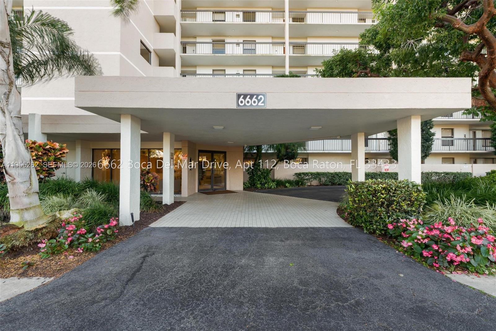 The exterior view shows a covered building entrance with a paved driveway and landscaping — 6662 Boca Del Mar Dr # 112, Boca Raton FL 33433, BOCA RATON, FL