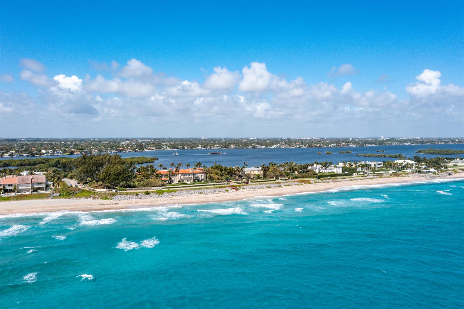 An aerial view of a coastal property featuring a sandy beach and turquoise ocean water — 1980 S Ocean Boulevard, Palm Beach FL 33480, PALM BEACH, FL