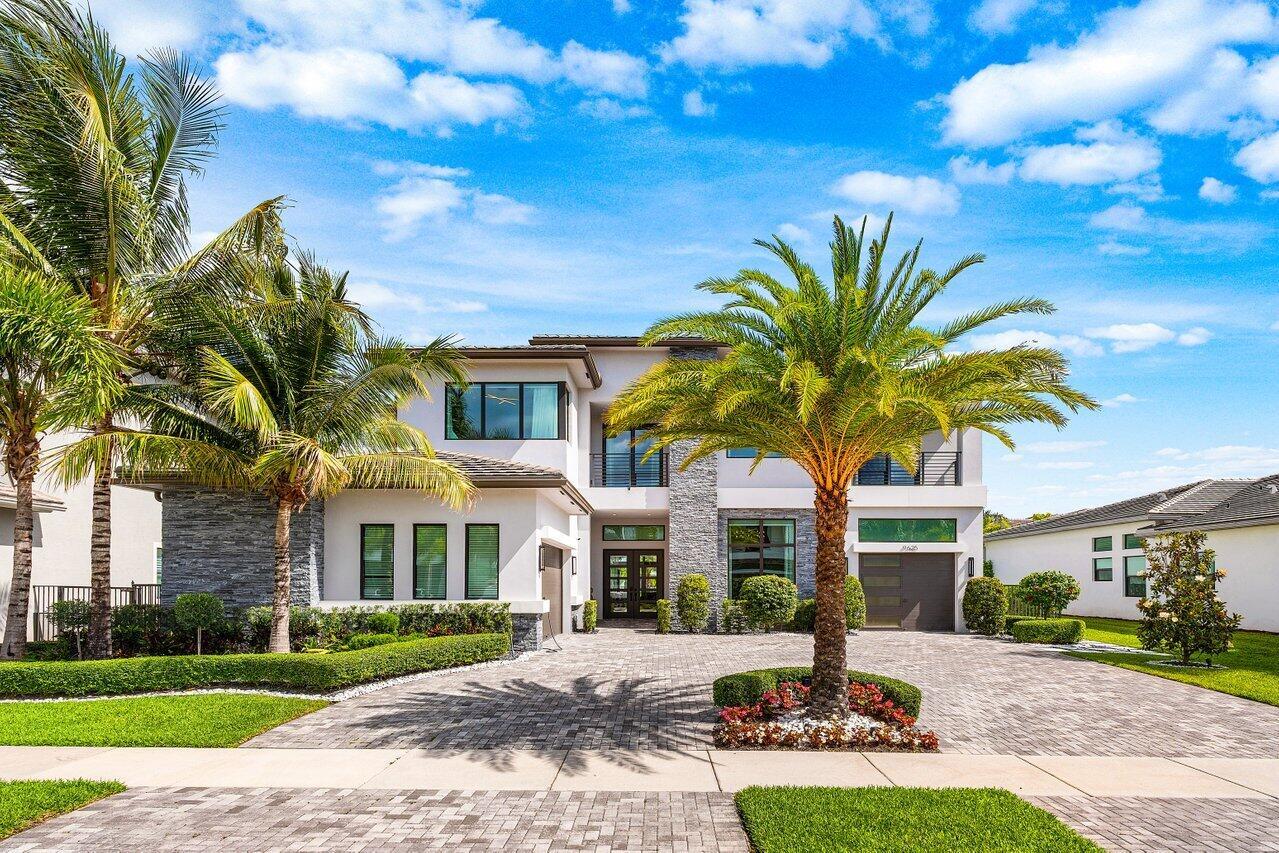 A two-story modern house with a stone facade, palm trees, and a paved driveway — 9625 Vescovato Way, Boca Raton FL 33496, BOCA RATON, FL