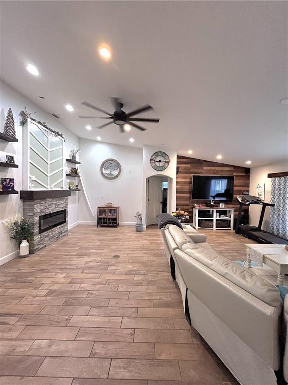 A gray exterior wall features a double front door with decorative glass panels and a porch — 209 ALTA VISTA STREET, DEBARY, FL