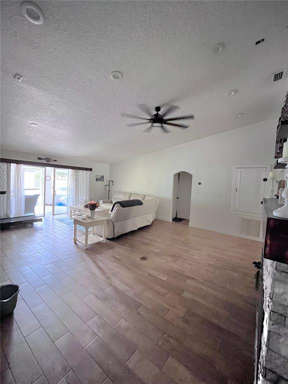 An entryway features a wood-beamed ceiling, tile flooring, a built-in bench, and double glass doors — 209 ALTA VISTA STREET, DEBARY, FL