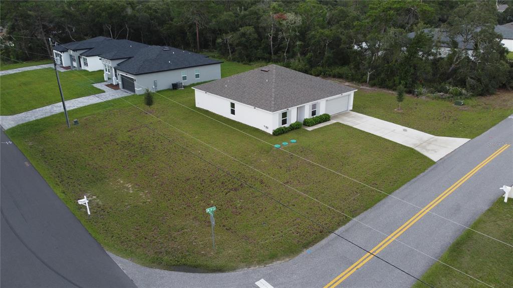 An aerial view shows a white house with a gray roof and a large corner lot — 17294 SW 39TH CIRCLE, OCALA, FL