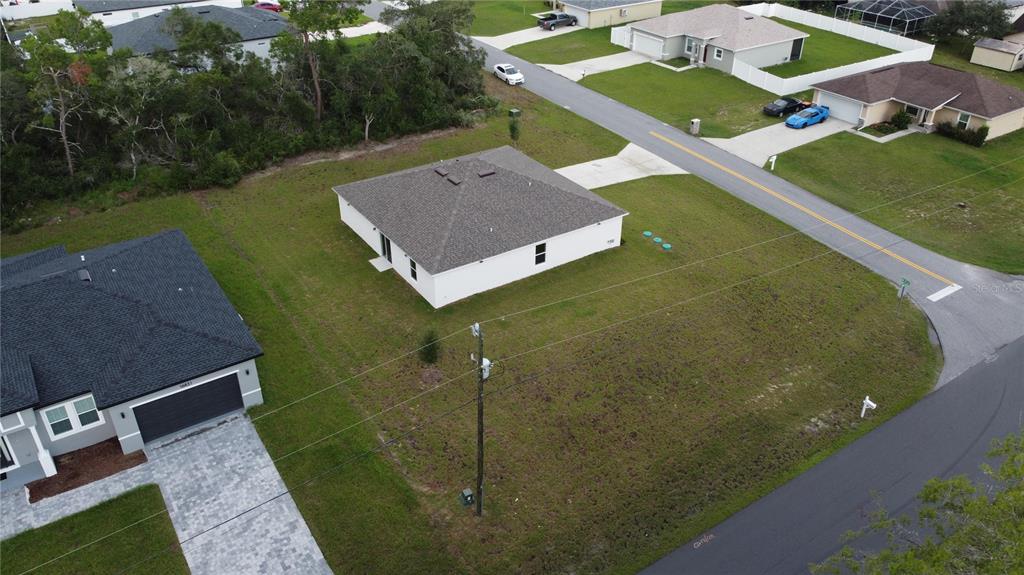 An aerial view shows a single-story house situated on a large, grassy corner lot — 17294 SW 39TH CIRCLE, OCALA, FL