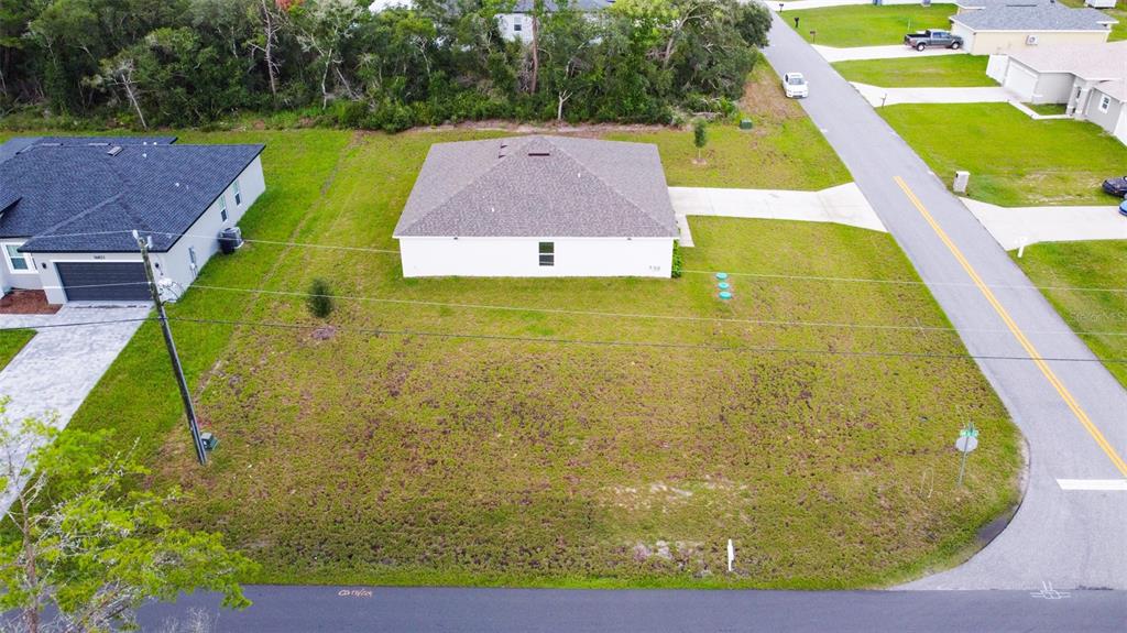 An aerial view shows a single-story house with a gray roof on a corner lot — 17294 SW 39TH CIRCLE, OCALA, FL