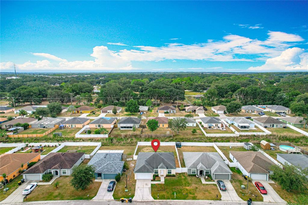 An aerial view shows a suburban neighborhood with a marked single-family home — 1639 SADDLEHORN DRIVE, LAKELAND, FL