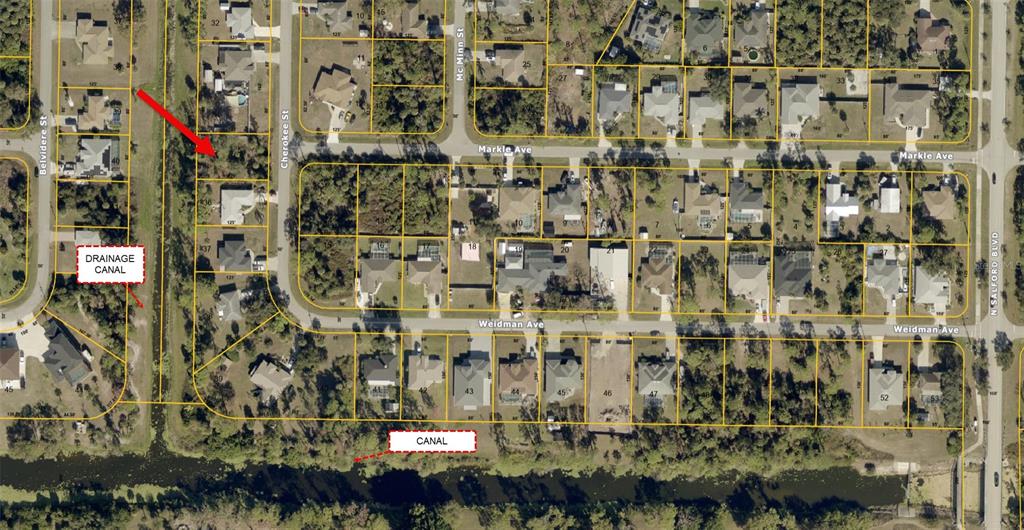 This is an aerial map showing residential lots, streets, and a canal — CHEROKEE STREET, NORTH PORT, FL