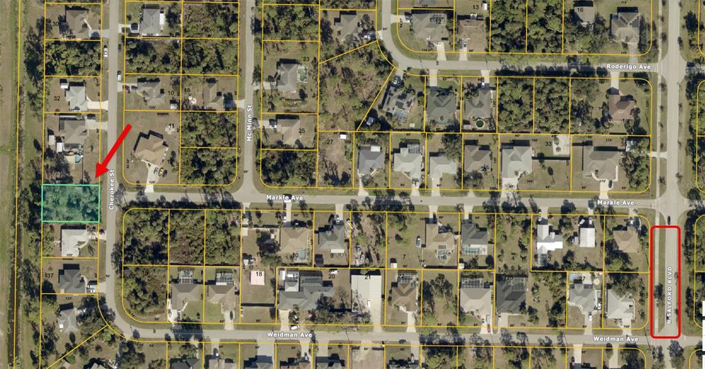 This is an aerial map showing a vacant residential lot highlighted in a neighborhood — CHEROKEE STREET, NORTH PORT, FL