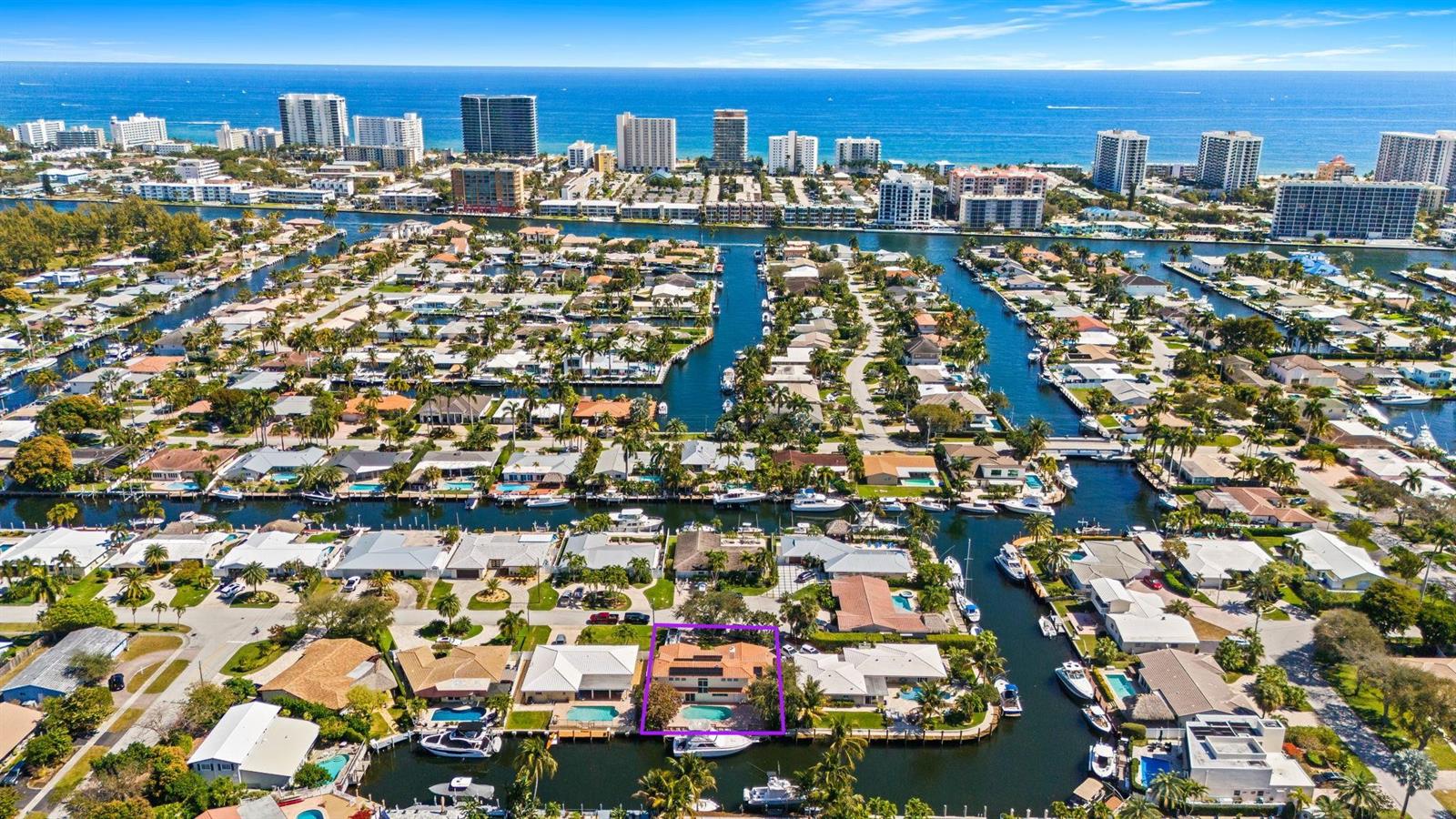 An aerial view of a waterfront neighborhood with a highlighted house featuring a pool — 1031 NE 27th Avenue, Pompano Beach FL 33062, POMPANO BEACH, FL