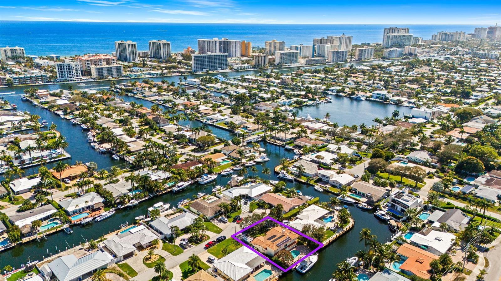 An aerial view shows a waterfront house with a pool and boat dock in Florida — 1031 NE 27th Avenue, Pompano Beach FL 33062, POMPANO BEACH, FL