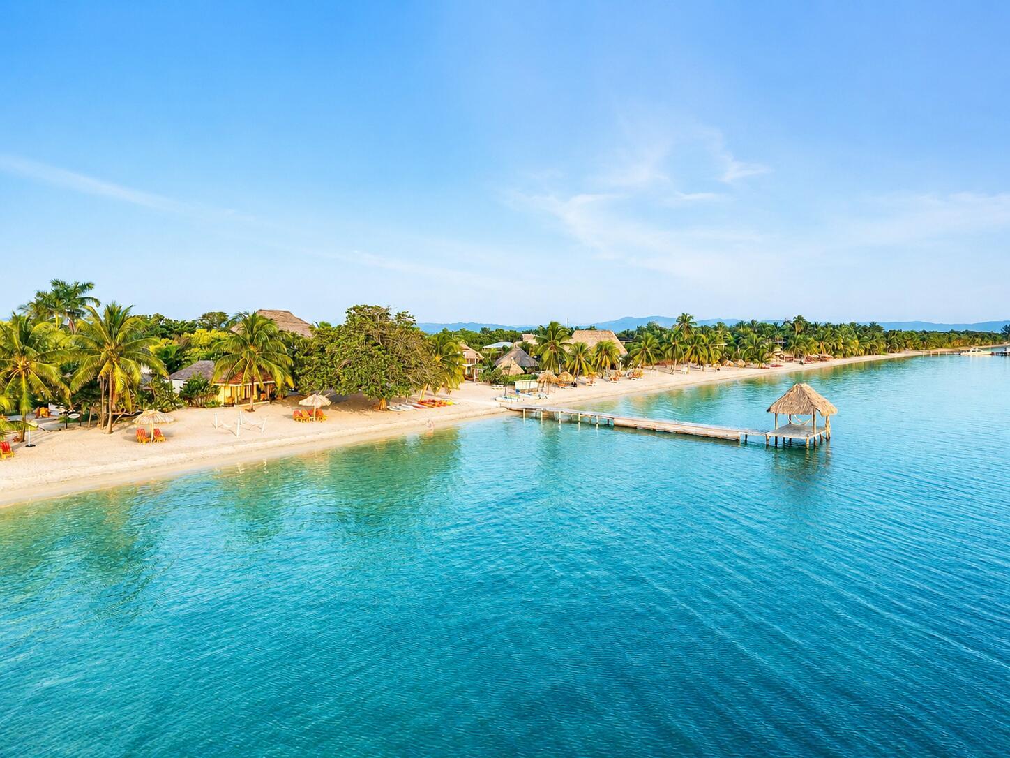 An aerial view of a tropical beach resort with a wooden pier and thatched gazebo — Lot 37 Sittee River Road Lot 37, FL