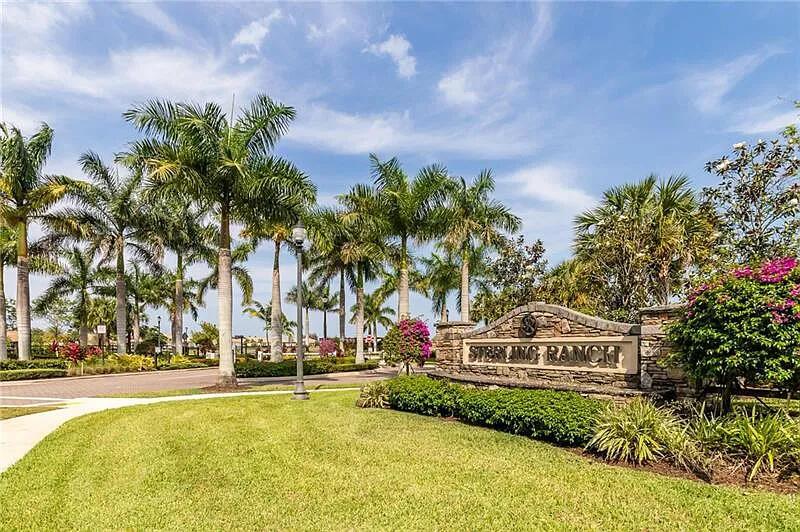 A stone entrance sign for Sterling Ranch is surrounded by palm trees and landscaping — 5716 S Sterling Ranch, Davie FL 33314, DAVIE, FL