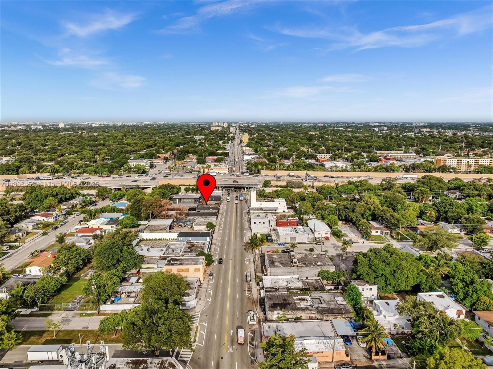 An aerial view shows a commercial building marked with a pin along a busy road — 570 NW 54th St, Miami FL 33127, MIAMI, FL