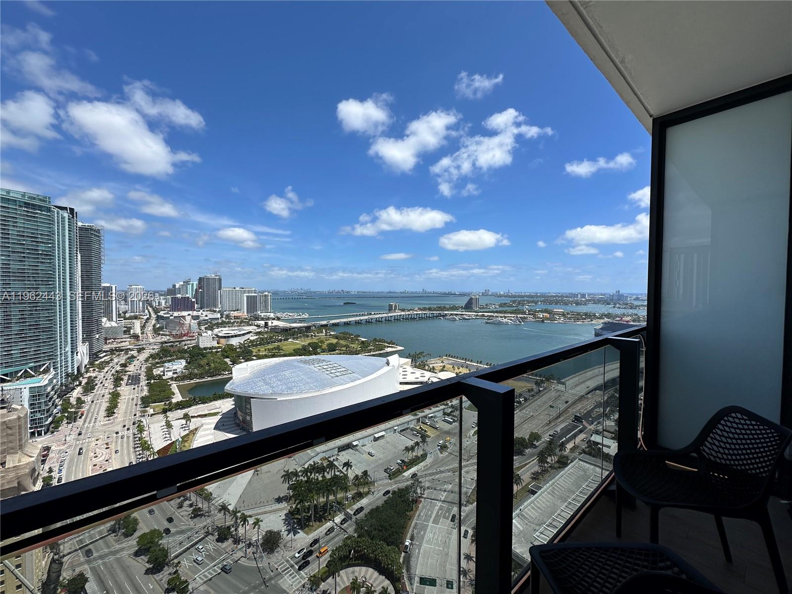 A high-rise balcony overlooks the Kaseya Center, Biscayne Bay, and the Miami skyline — 398 NE 5th St # 3008, Miami FL 33132, MIAMI, FL