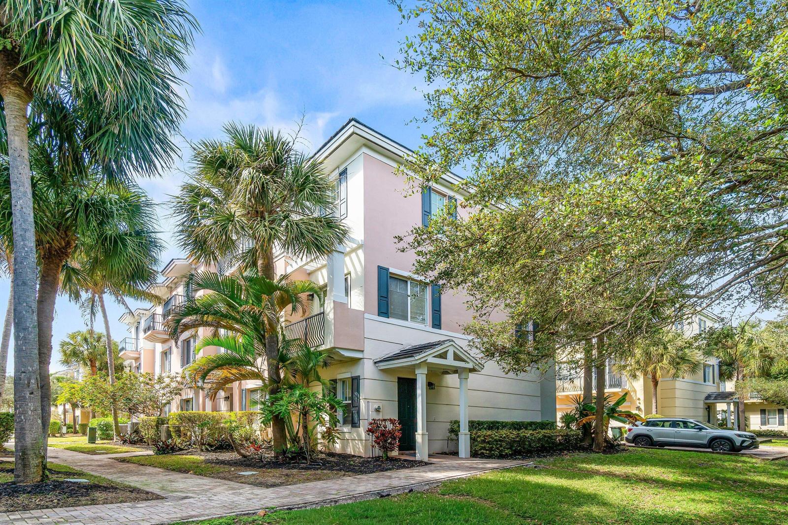 A three-story pink apartment building with palm trees and a paved walkway in front — 3830 NW 5th Terrace, Boca Raton FL 33431, BOCA RATON, FL