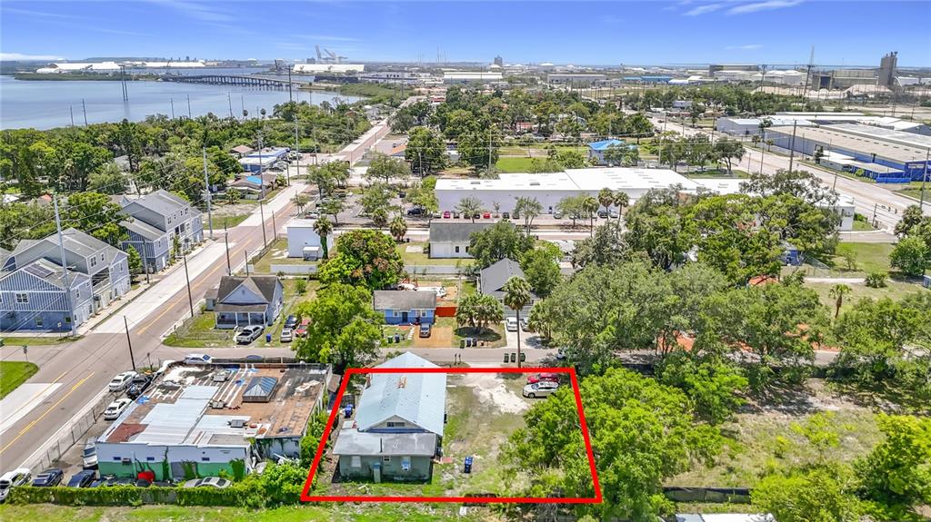 An aerial view shows a small house on a lot outlined in red — 2020 DAVIS STREET, TAMPA, FL
