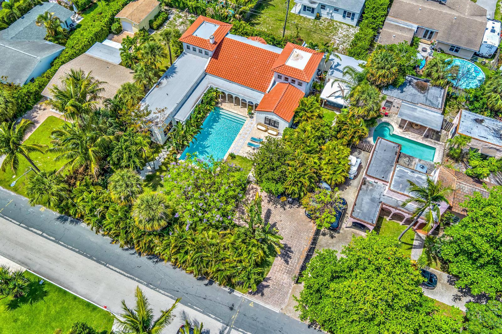 An aerial view shows a house with a red tile roof and a swimming pool — 333 Murray Road, West Palm Beach FL 33405, WEST PALM BEACH, FL