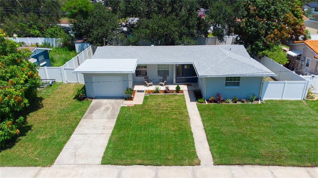 An aerial view of a single-story house with a gray roof and a front lawn — 5919 33RD AVENUE N, ST PETERSBURG, FL