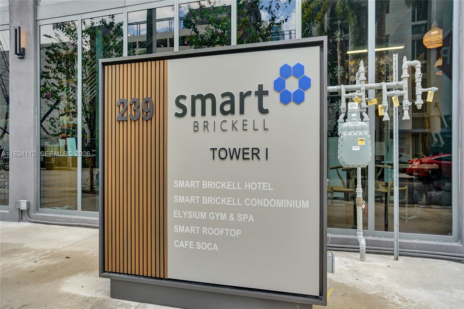A sign for Smart Brickell Tower I stands on a sidewalk in front of a building — 239 SW 9th St # 2203, Miami FL 33130, MIAMI, FL