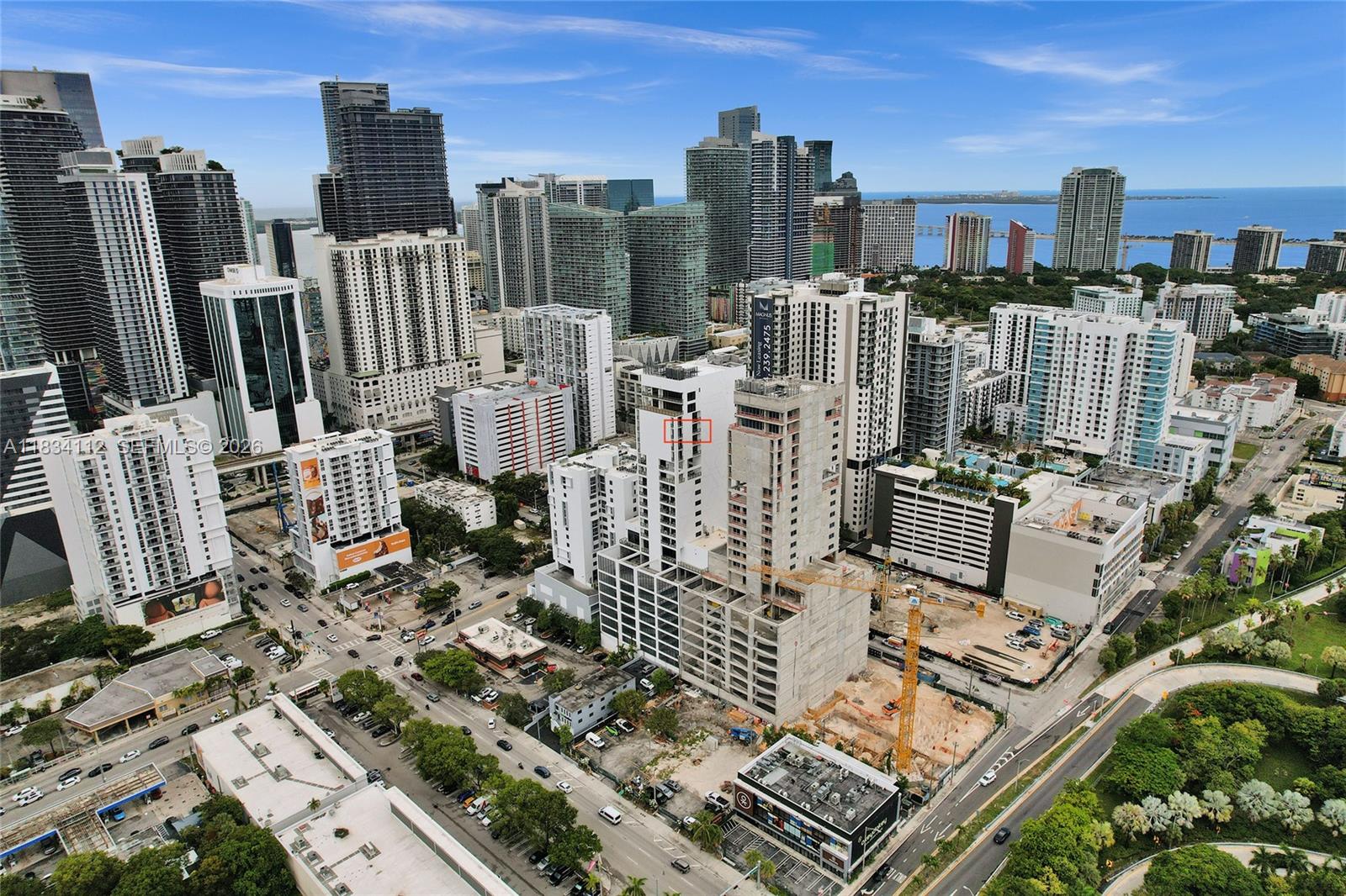 An aerial view of a dense urban cityscape featuring high-rise buildings and active construction sites — 239 SW 9th St # 2203, Miami FL 33130, MIAMI, FL