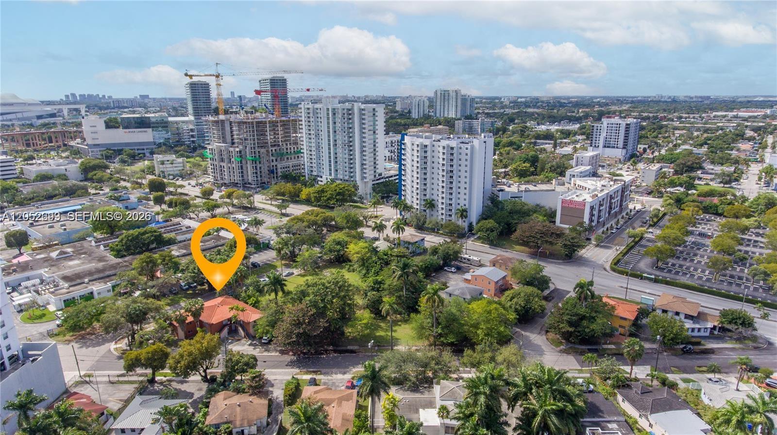 An aerial view shows a residential neighborhood with a highlighted house and nearby high-rise buildings — 1333 NW 15th St # 10, Miami FL 33125, MIAMI, FL