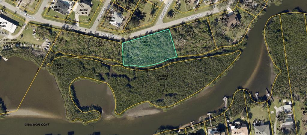 This aerial map shows a vacant, wooded residential lot outlined in teal along a waterway — YACHT CLUB DRIVE, VENICE, FL