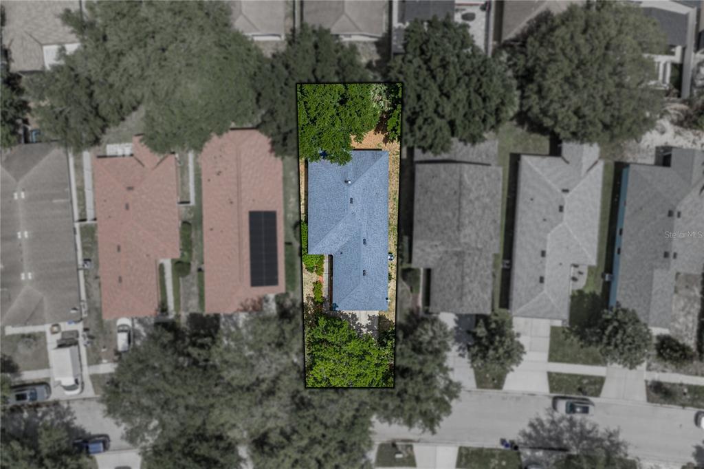 An aerial view shows a single-family home with a blue roof on a narrow lot — 11578 HAMMOCKS GLADE DRIVE, RIVERVIEW, FL