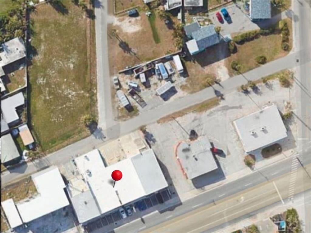 This aerial map view shows a commercial building with a red location pin — 2012 S ATLANTIC AVENUE, DAYTONA BEACH, FL