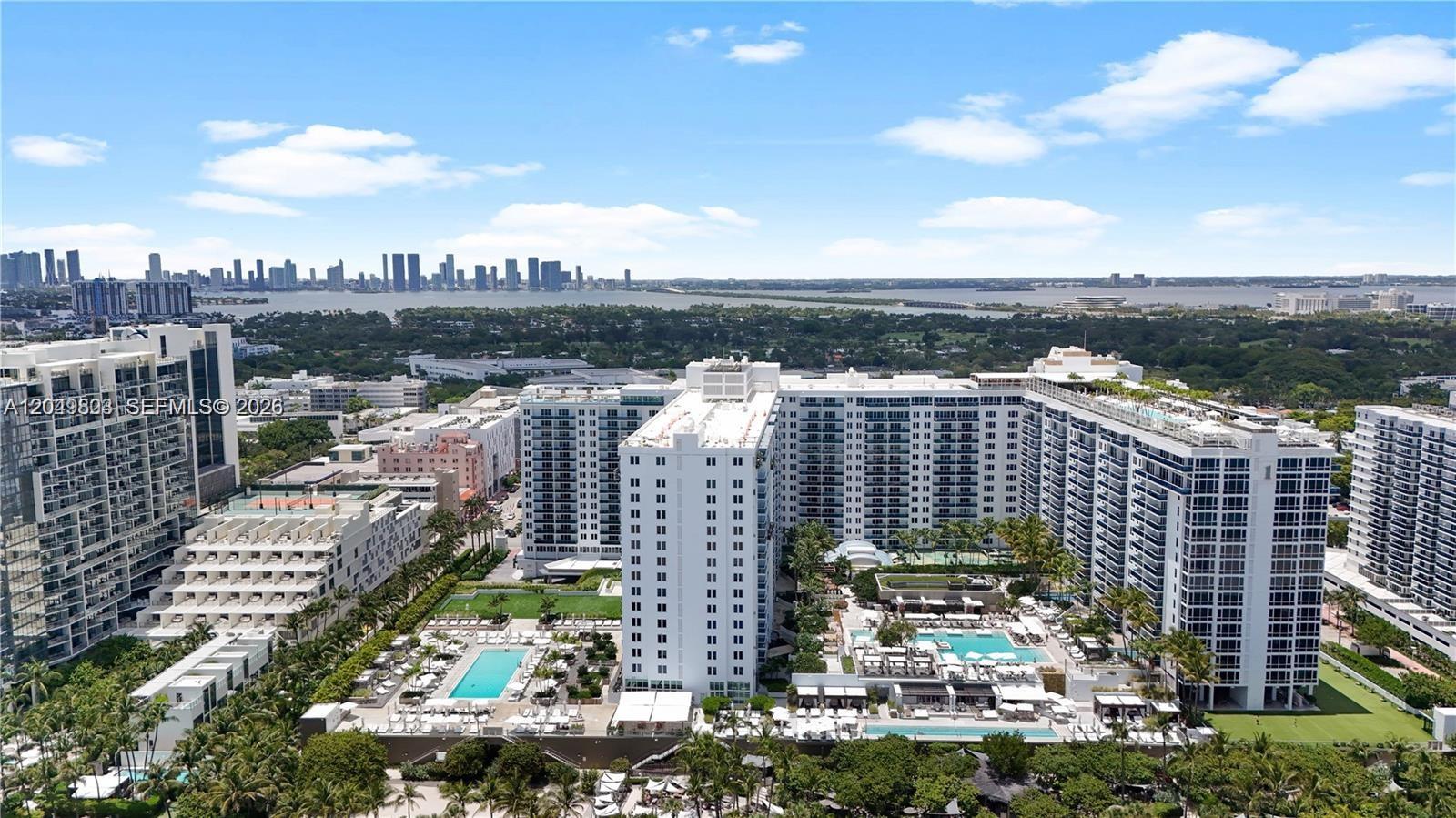 An aerial view of a large residential complex with multiple swimming pools and surrounding landscaping — 2301 Collins Ave # 414, Miami Beach FL 33139, MIAMI BEACH, FL
