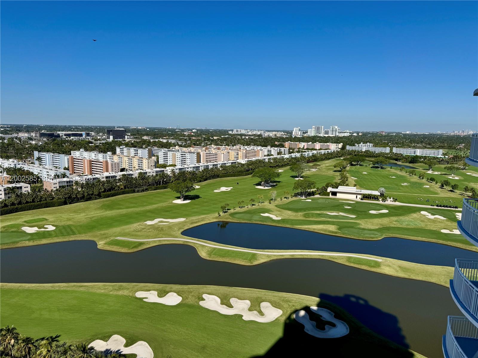 An elevated view of a golf course with water hazards, sand traps, and surrounding apartment buildings — 1745 E Hallandale Beach Blvd # 2001W, Hallandale Beach FL 33009, HALLANDALE BEACH, FL