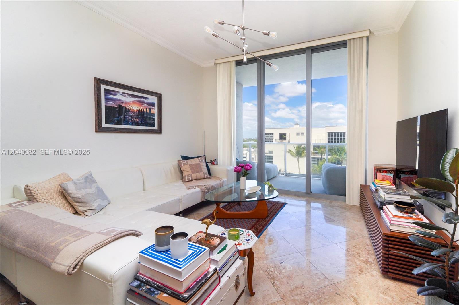 A living room features a white sectional sofa, glass coffee table, and balcony access — 3470 E Coast Ave # H1109, Miami FL 33137, MIAMI, FL
