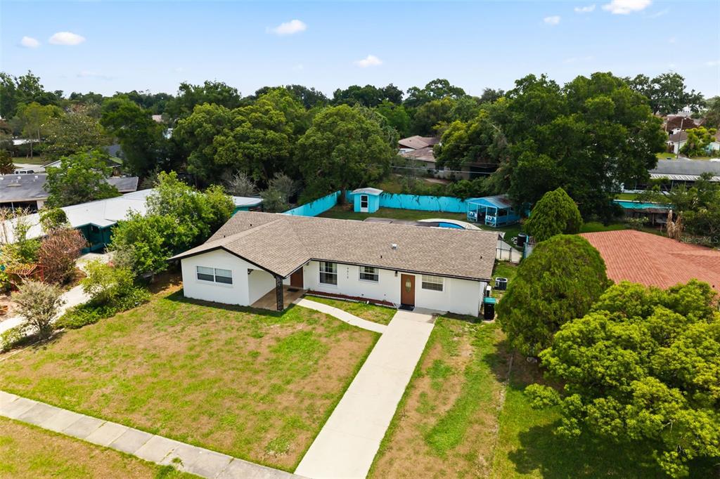 An aerial view of a single-story white house with a brown roof and a yard — 4515 BRADLEY AVENUE, ORLANDO, FL