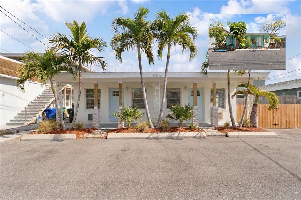 A single-story duplex building with palm trees and a paved parking area in front — 7815 BOCA CIEGA DRIVE, ST PETE BEACH, FL