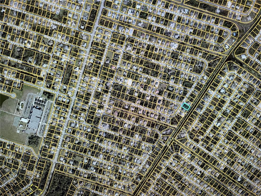 This is an aerial map view of a residential neighborhood with a highlighted lot — LOT 27 MCGINNIS TERRACE, NORTH PORT, FL