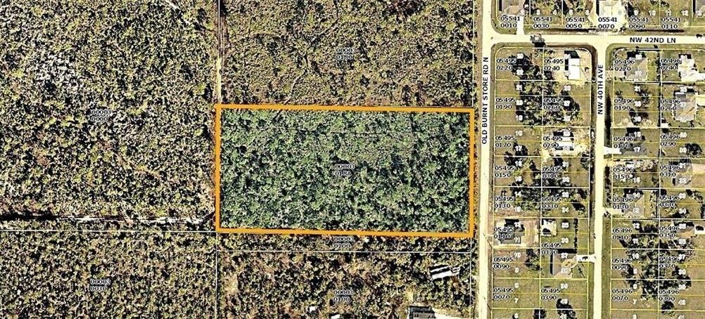 This is an aerial map showing a rectangular parcel of land outlined in orange — 4170 OLD BURNT STORE RD, CAPE CORAL, FL