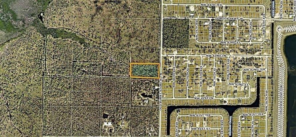 This is an aerial map showing a rectangular parcel of land highlighted in orange — 4170 OLD BURNT STORE RD, CAPE CORAL, FL