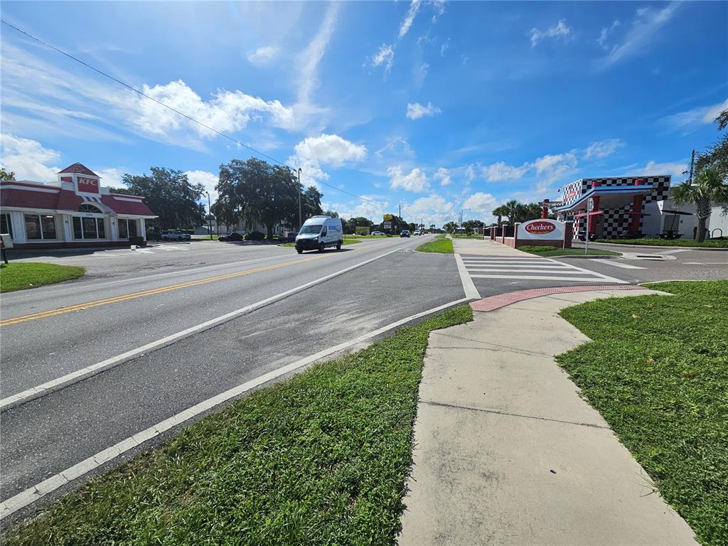 A street-level view shows a KFC and a Checkers restaurant on opposite sides of a road — 0 GALL BOULEVARD, ZEPHYRHILLS, FL