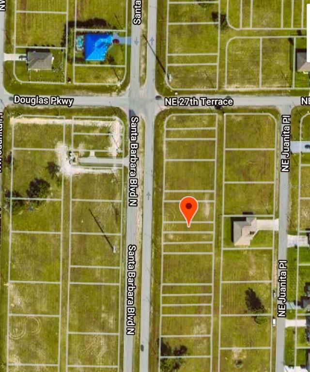 This is an aerial map view showing a vacant residential lot marked with a pin — 2713 SANTA BARBARA BOULEVARD N, CAPE CORAL, FL