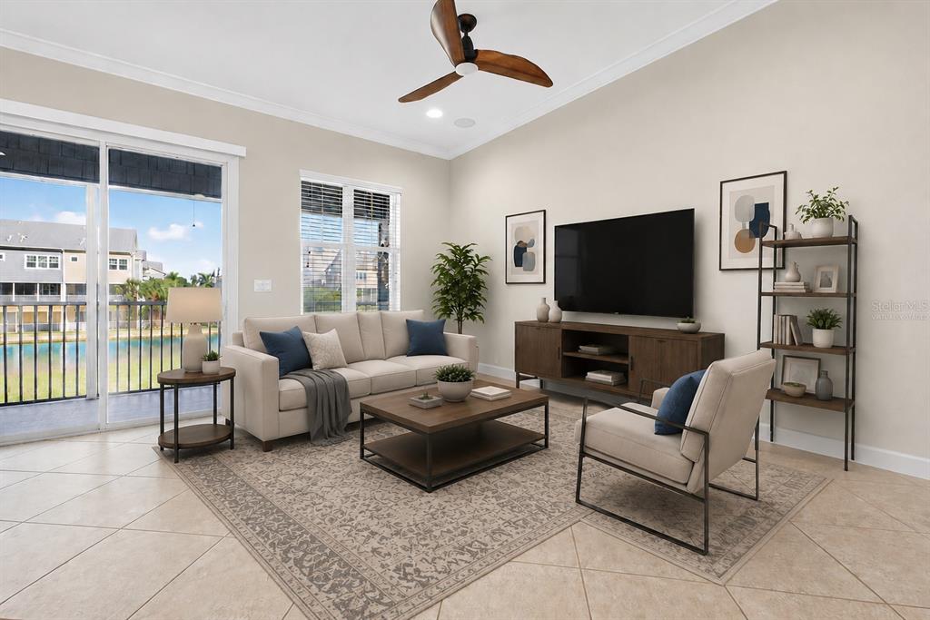 A living room features a sofa, armchair, coffee table, media console, and a view of water — 6080 MOORINGS DRIVE S, ST PETERSBURG, FL
