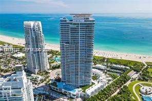 An aerial view shows two tall residential towers situated along a sandy beach and ocean — 100 S Pointe Dr # 3702, Miami Beach FL 33139, MIAMI BEACH, FL