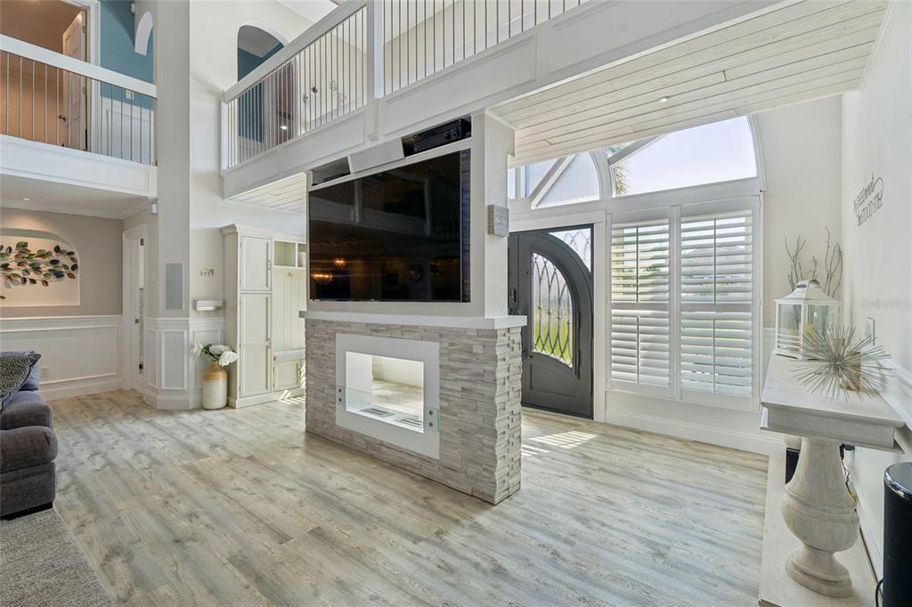 A screened-in pool patio features a bar, lounge seating, and a hammock under a roof — 2484 ALBANY DRIVE, KISSIMMEE, FL