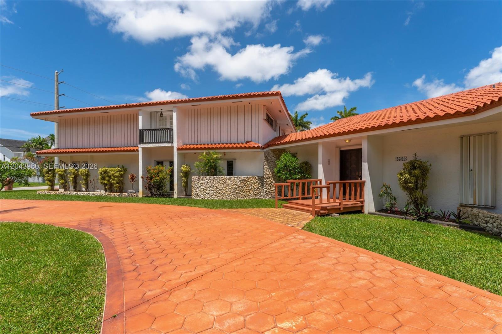 A two-story house with a terracotta tile roof and a stamped concrete driveway — 8390 SW 2nd St # 0, Miami FL 33144, MIAMI, FL